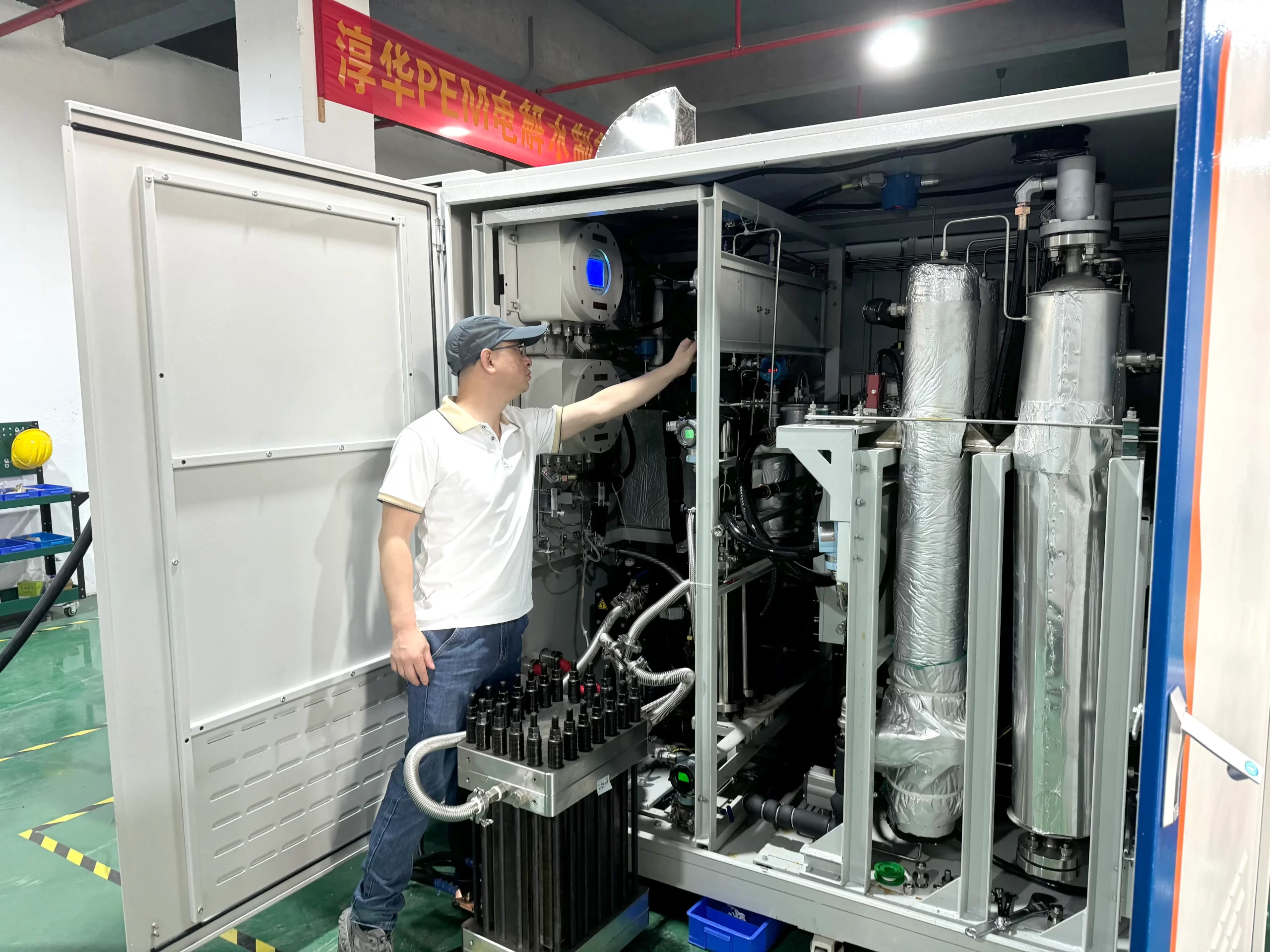 PEM electrolyzer skid, stack assembly, control cabinet, and FAT testing scene